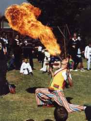 Damien blowing fire