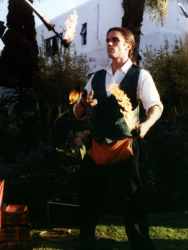 Damien the fire juggler juggling with fire clubs